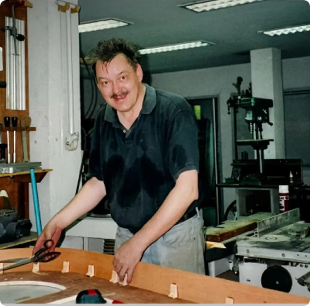 Klaus Kummer shaping a seat frame in his workshop