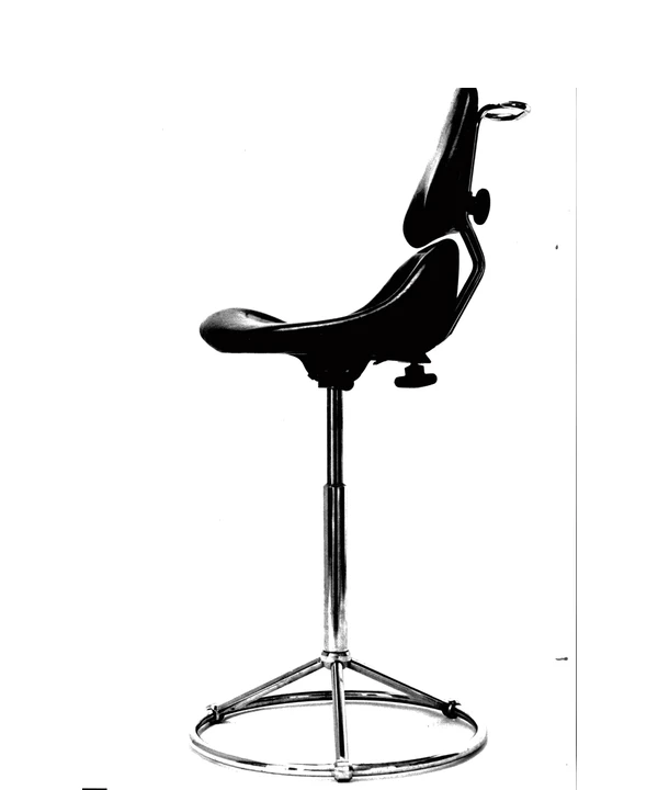 Early sculpted chair prototype on a metal pedestal base