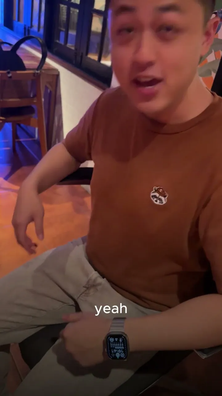 A man in a brown shirt seated in Vision